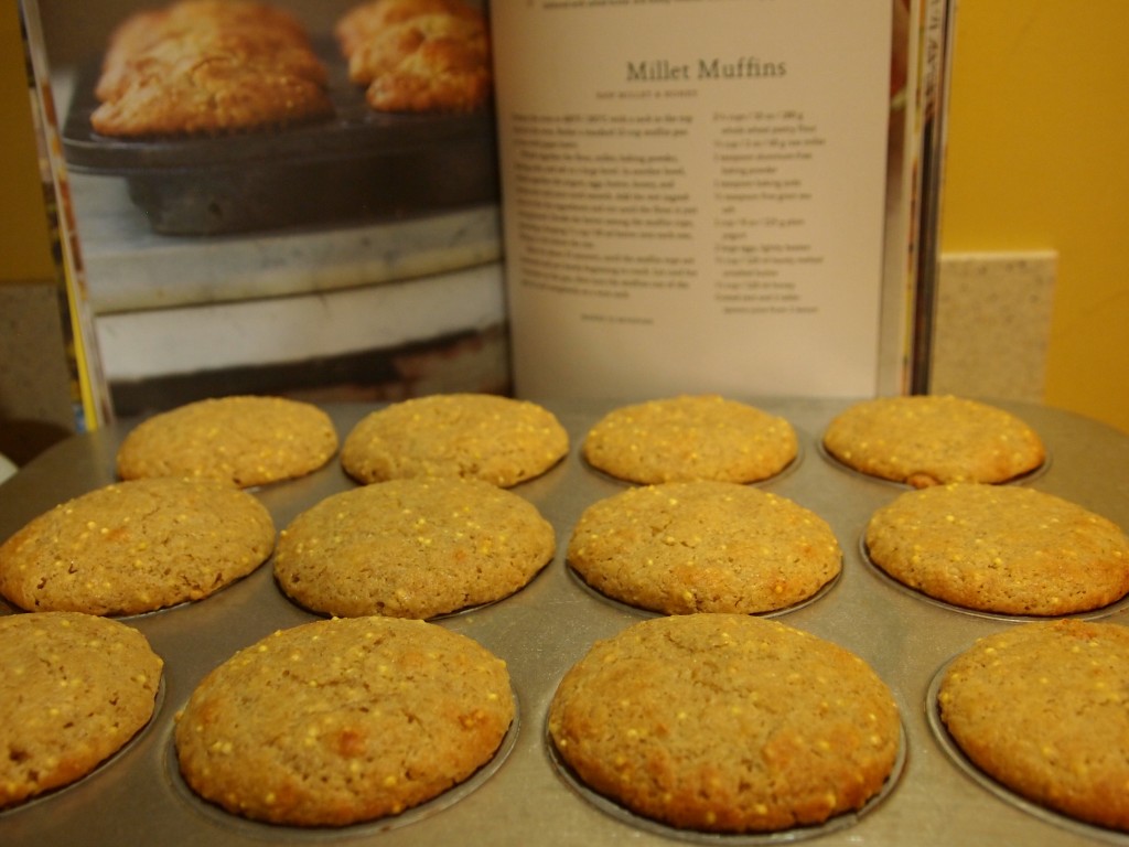 muffins in pan with cookbook